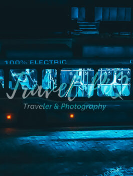 Electric City Bus at Night with Interior Lights and Zero Emissions Concept