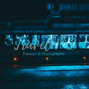 Electric City Bus at Night with Interior Lights and Zero Emissions Concept